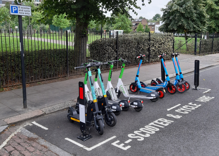 Scooters parked in a scooter parking bay on the road
