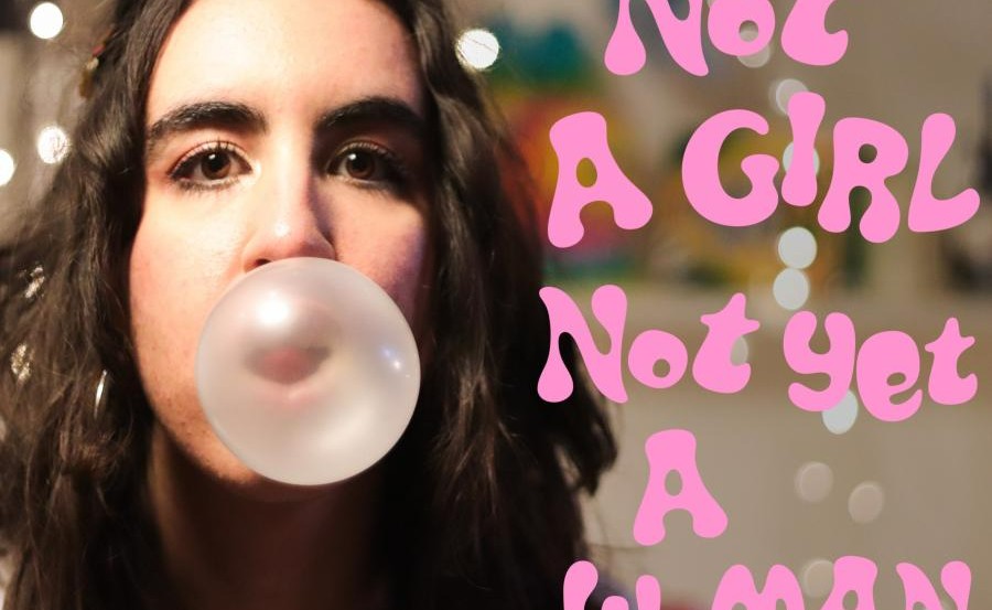 A woman pops a pink bubblegum to the camera, there is pink bubble style text next to her which reads: Not a girl, not yet a woman